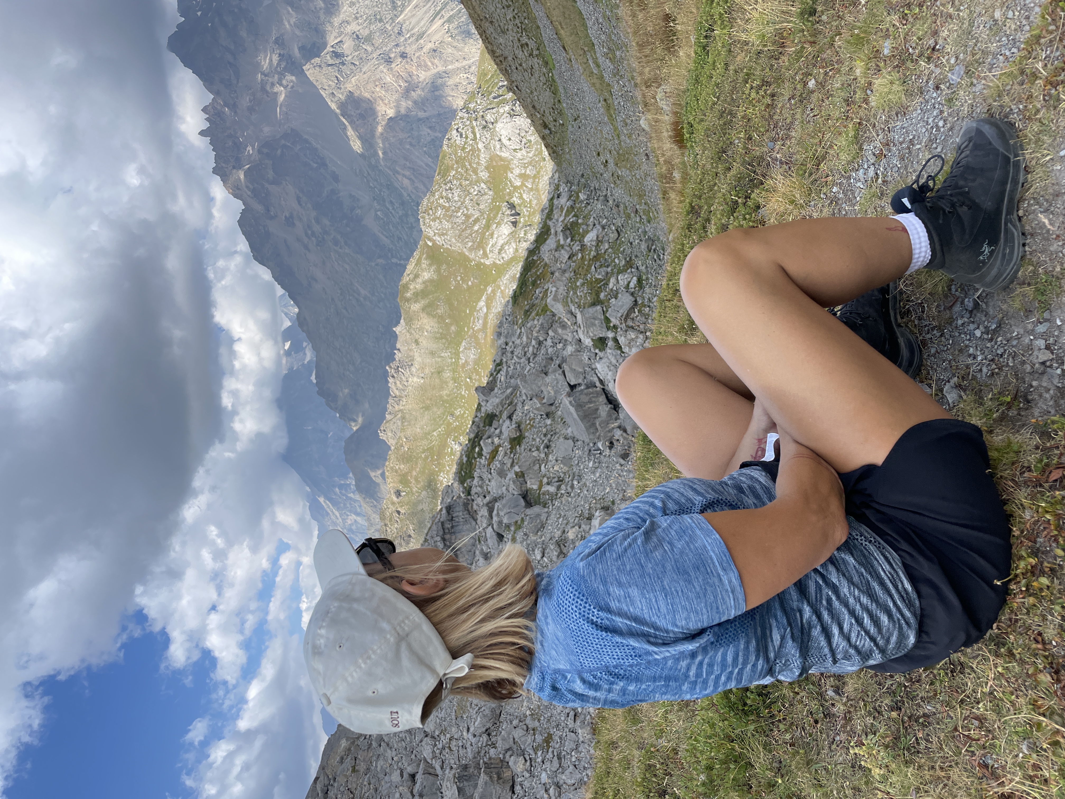 Hiker taking in the Alpine summer panorama
